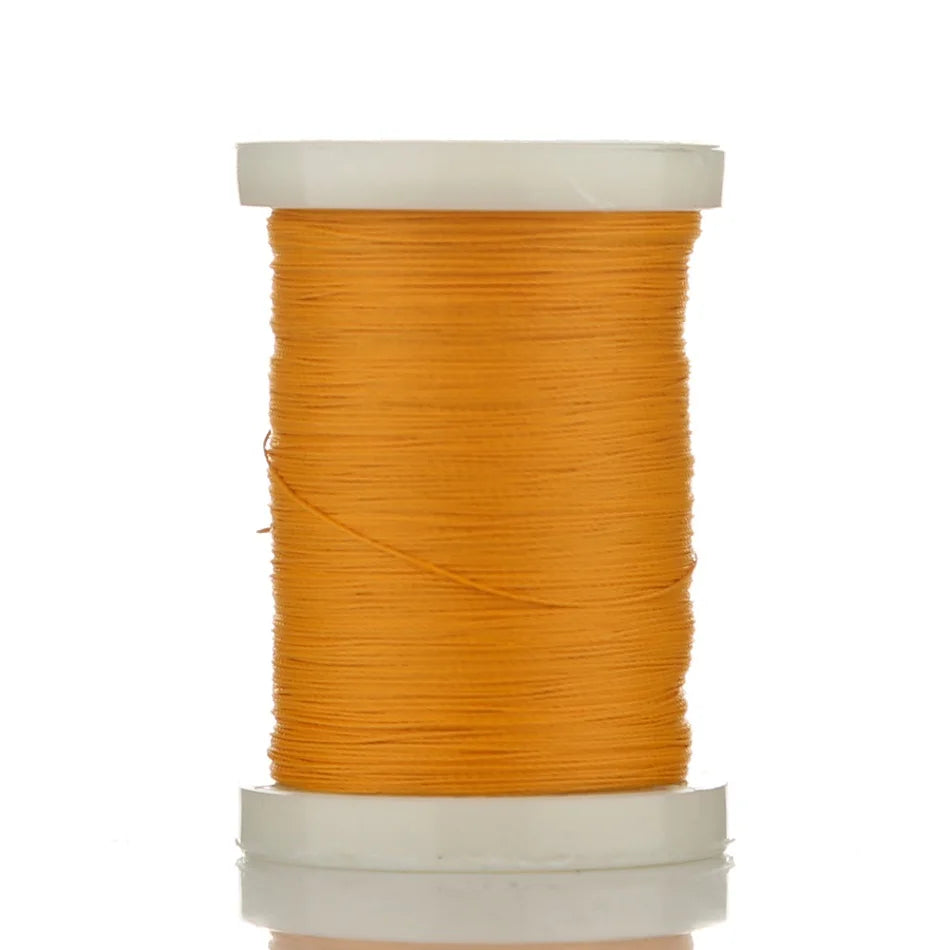 A spool of bright orange braided polyester thread for guide tying and repairs.