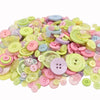 A pile of assorted eco-friendly wooden buttons in various pastel colors including pink, yellow, green, and blue.