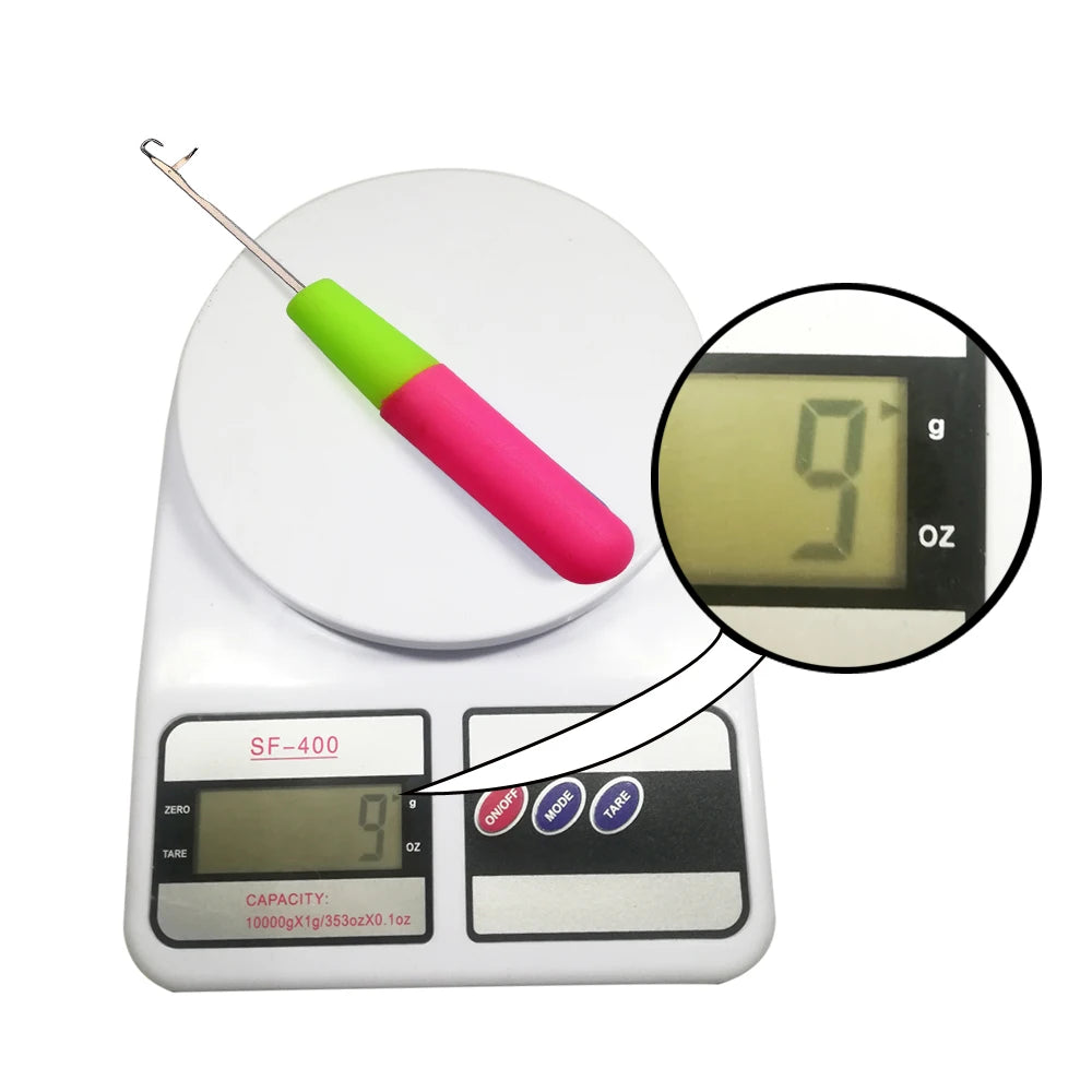 A digital scale with a metal needle and a pink handle, showing a weight measurement.