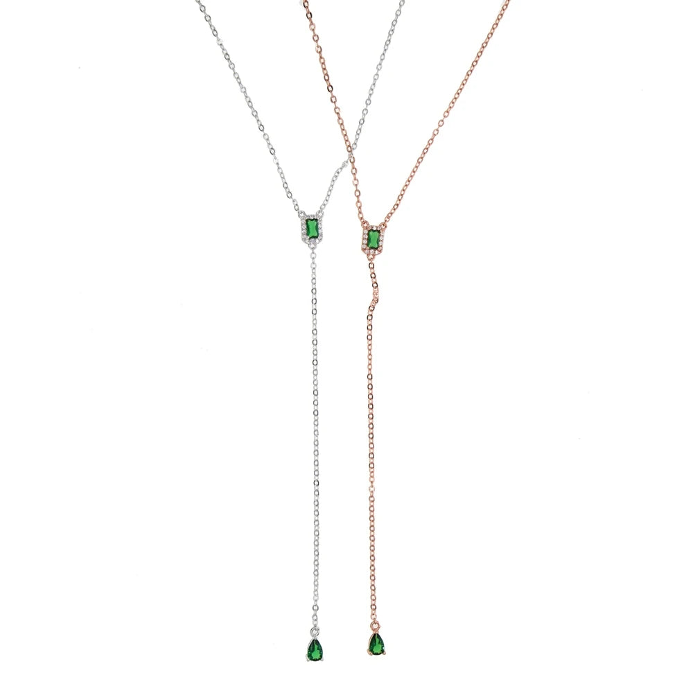 A delicate geometric teardrop lariat necklace featuring cubic zirconia stones on a silver-toned chain.