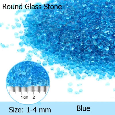 A pile of bright blue round glass stones ranging in size from 1 to 4 mm.