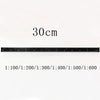 A black aluminum triangular scale ruler marked with measurements up to 30 cm.