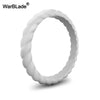 A close-up view of a white braided silicone ring.