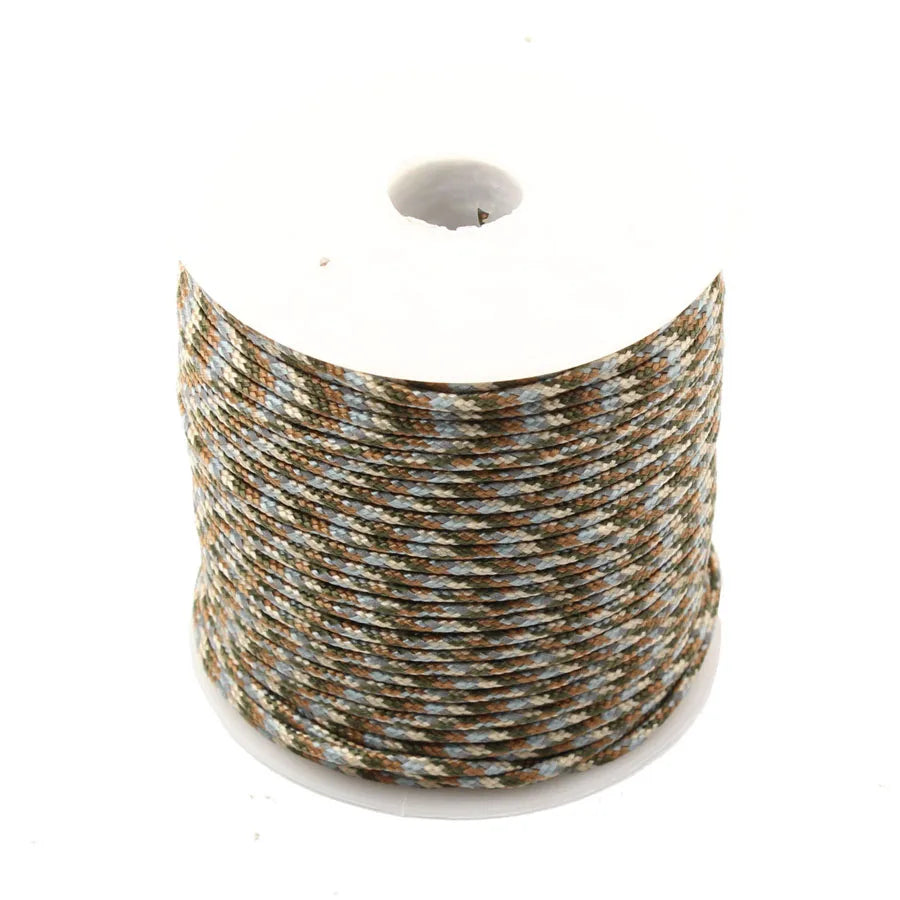 Spool of high-visibility reflective paracord with brown and blue stripes.