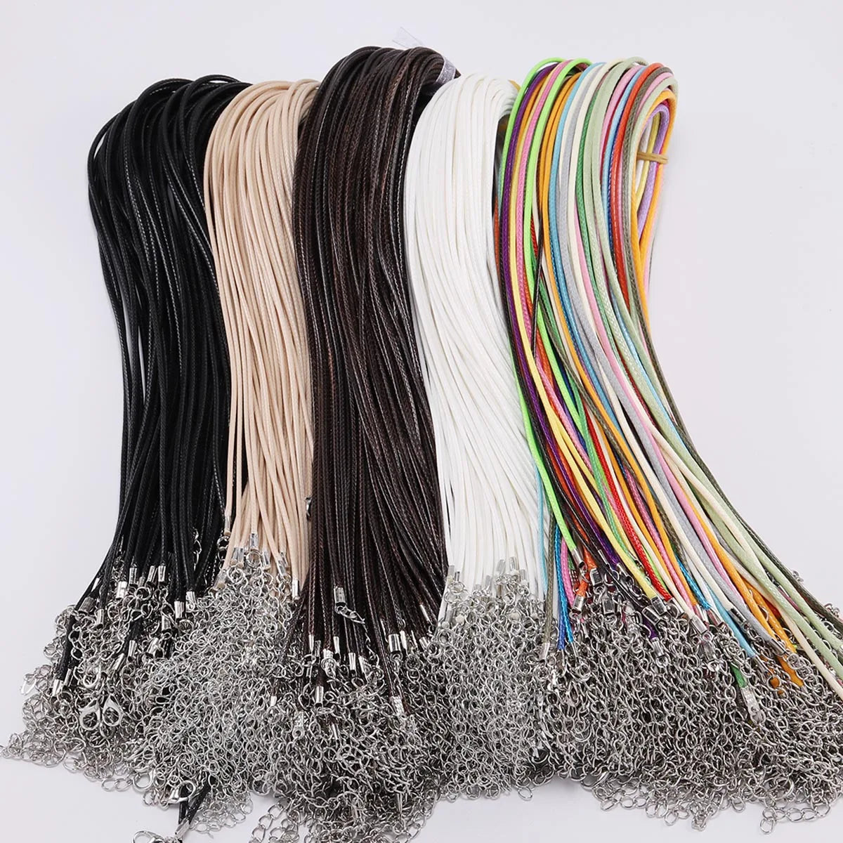 A collection of adjustable leather cord necklaces in various colors including black, beige, brown, and multicolored strands.