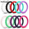 A collection of braided silicone rings in various colors including black, white, red, green, and purple.