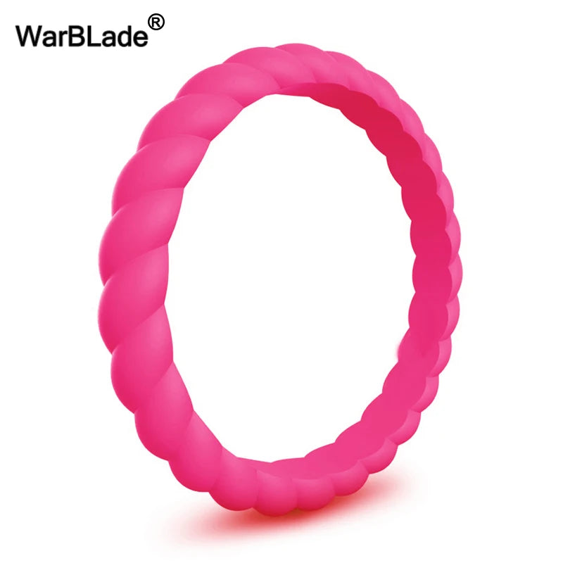 A close-up view of a bright pink braided silicone ring.