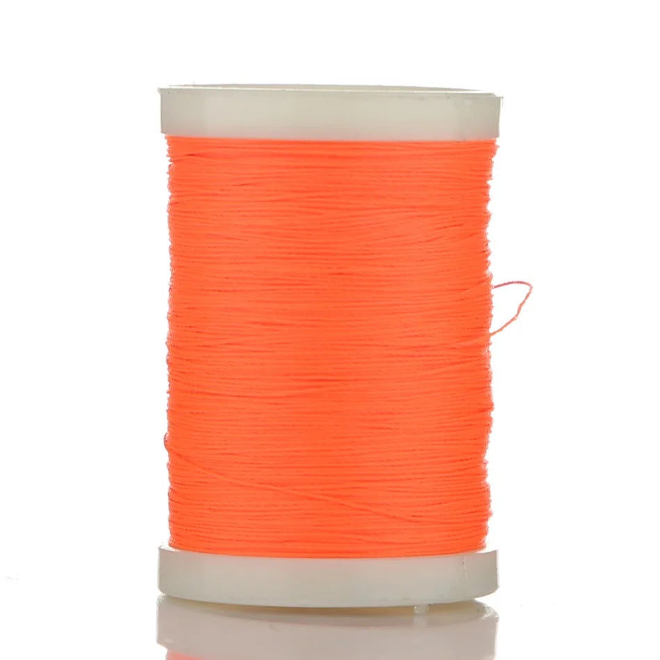 A spool of bright orange braided polyester thread for guide tying and repairs.