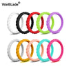 A collection of braided silicone rings in various colors including white, black, red, green, and purple.