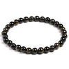 A stretch bracelet made of natural black gold obsidian gemstones.
