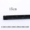 A black aluminum triangular scale ruler marked with various scales including 1:100 to 1:600.