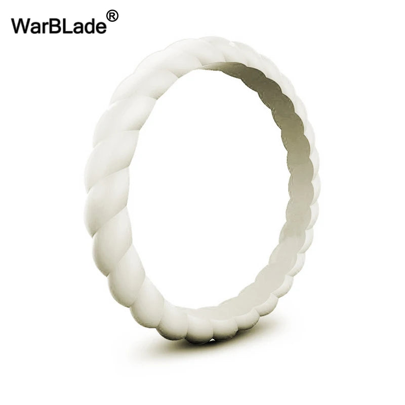 A close-up view of a white braided silicone ring, likely a wedding band or sport-friendly accessory.