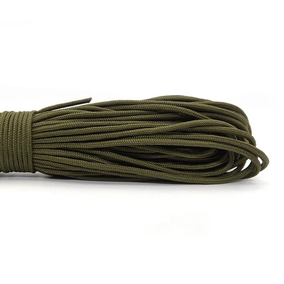 A coil of 2mm multi-color paracord in olive green.