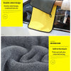 A yellow double-sided microfiber car wash towel is shown next to a dark gray plush cleaning cloth.