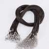 A coil of dark brown leather cord necklace with silver clasps
