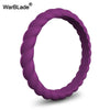A close-up view of a purple braided silicone ring on a white background.