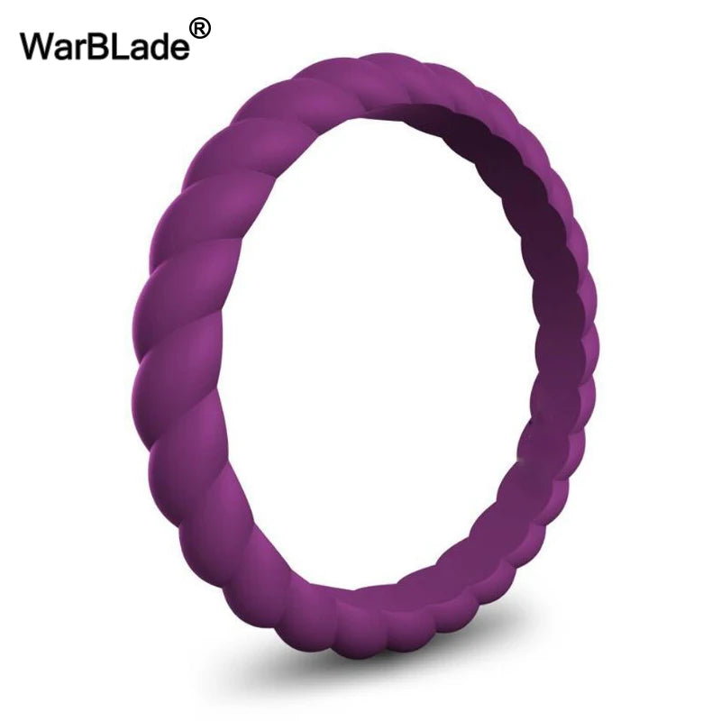 A close-up view of a purple braided silicone ring on a white background.