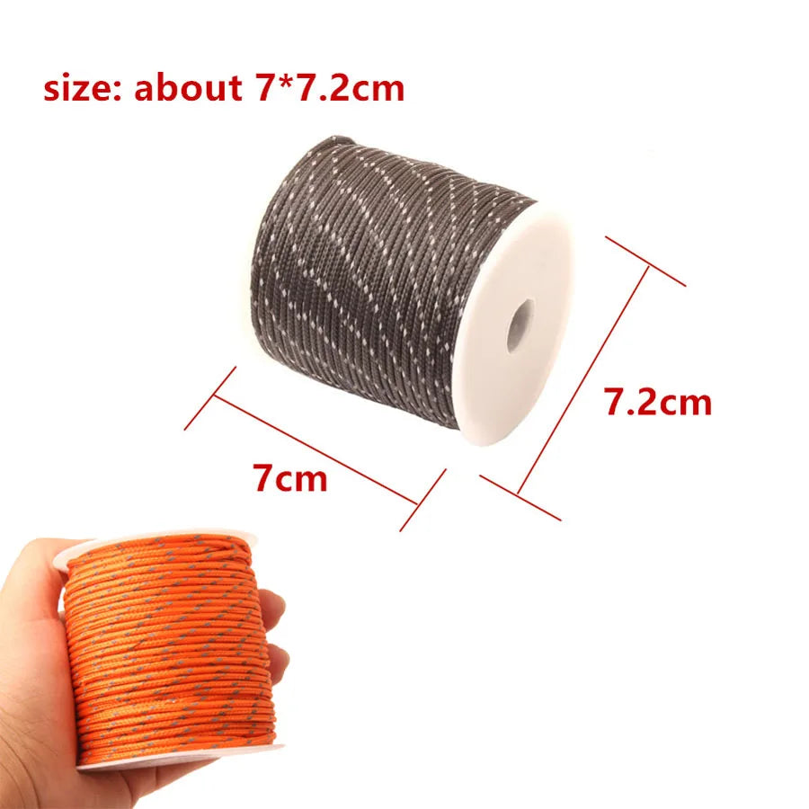 A spool of gray high-visibility reflective paracord with dimensions about 7x7.2cm.