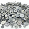 A close-up view of an assortment of small, round wooden buttons in various shades of gray and natural wood tones.