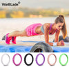 A collection of braided silicone rings in various colors including white, pink, black, purple, and green.