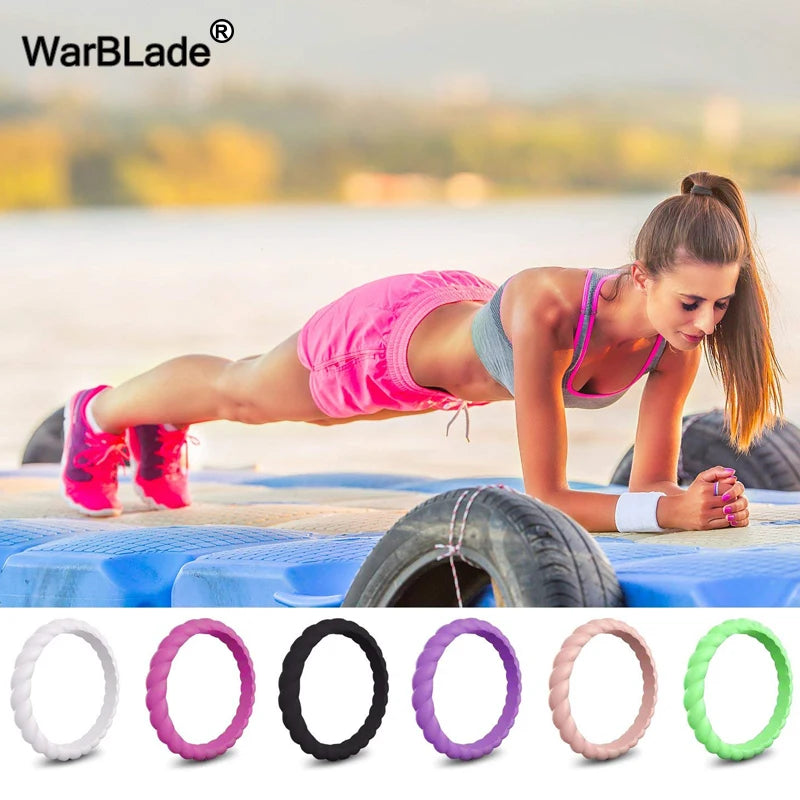 A collection of braided silicone rings in various colors including white, pink, black, purple, and green.