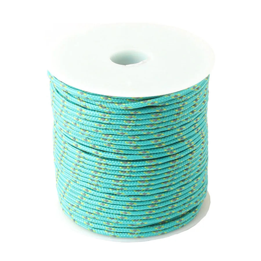 Spool of bright turquoise high-visibility reflective paracord rope.
