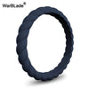A close-up view of a dark blue braided silicone ring.