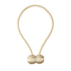 A delicate gold-colored cord with two small ball knots used as a curtain tieback.