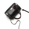 A black leather crossbody shoulder bag with a rose pendant and leather strap.