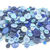 A large assortment of small, round wooden buttons in various shades of blue and purple for sewing and crafts.