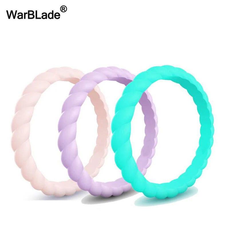 Three braided silicone rings in pink, purple, and teal displayed against a white background.