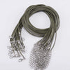 A coil of dark olive green adjustable leather cord necklace with silver clasps.
