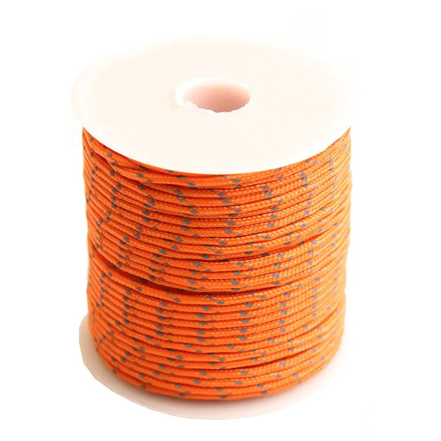 A roll of bright orange high-visibility reflective paracord coiled on a white background.