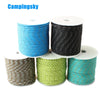 Rolls of high-visibility reflective paracord in blue, black, olive green, and teal for camping and DIY projects