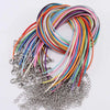 A bundle of multicolored leather cords and chains for making necklaces