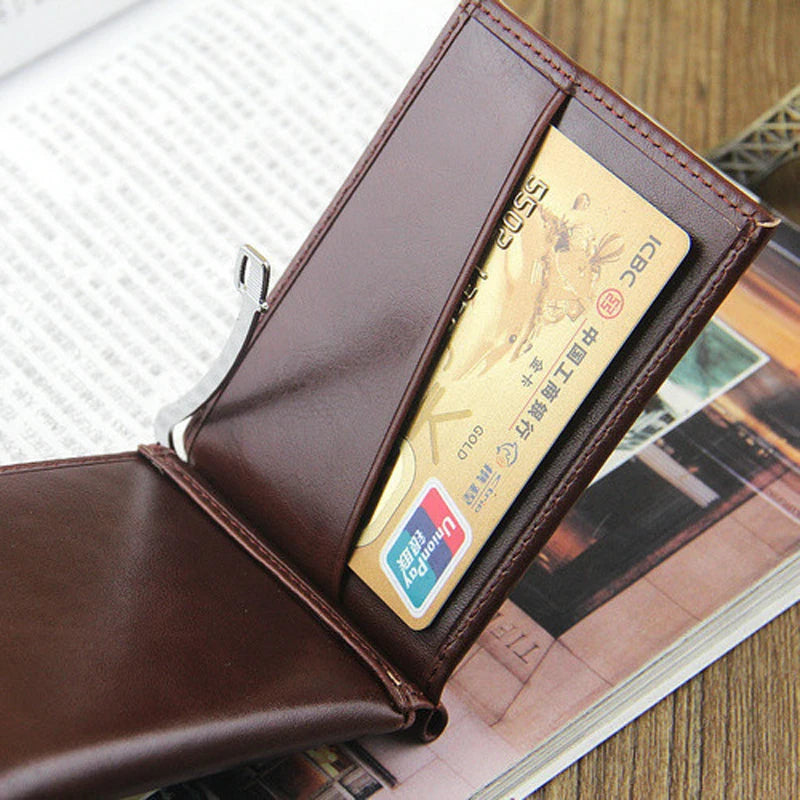 A brown leather wallet with a magnetic closure and an ID card visible inside, resting on a wooden surface.