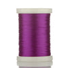 A spool of bright purple braided polyester thread for guide tying and repairs.
