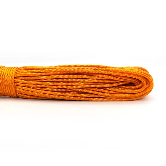 A coil of bright orange 2mm multi-color paracord rope.