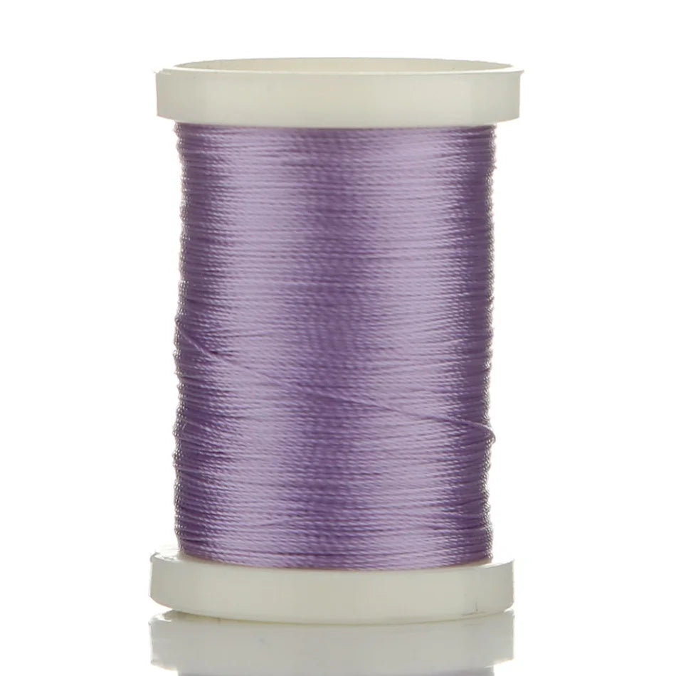 A spool of purple braided polyester thread for guide tying and repairs.