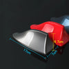 A red car shark fin antenna cover is shown next to a silver one, with dimensions marked.