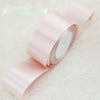 Roll of light pink satin ribbon measuring one inch wide and twenty-five yards long