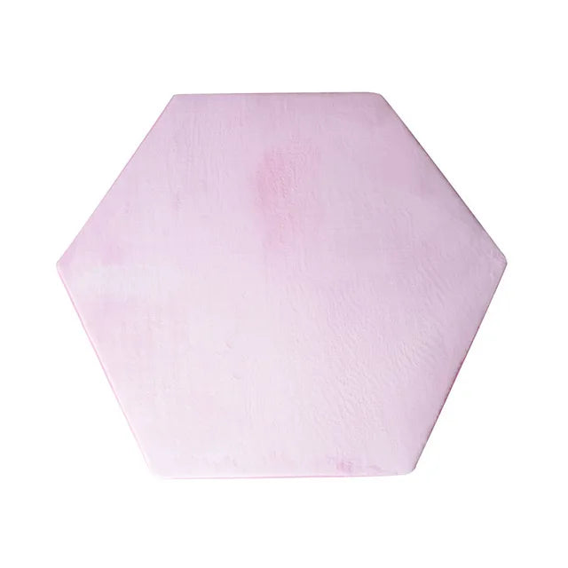 A pink hexagonal foldable play tent for children.