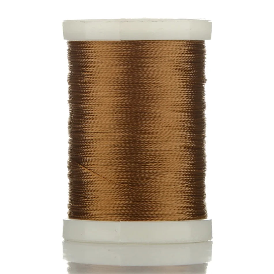 A spool of brown braided polyester thread used for guide tying and repairs.