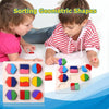Two children are sorting wooden geometric shapes into corresponding holes on a puzzle board.