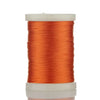 A spool of bright orange braided polyester thread for guide tying and repairs.