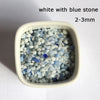 White with blue stone decorative pebbles measuring 2-3mm in a small container