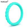 A close-up view of a bright cyan braided silicone ring.
