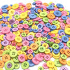 A large assortment of colorful wooden buttons in various sizes and shades for sewing and crafts
