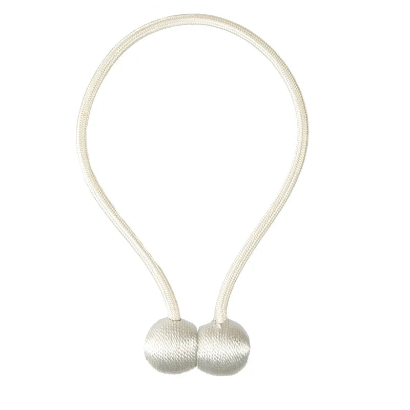 A delicate, cream-colored pearl ball curtain tieback made of fine cord.