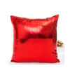 A square red metallic shine decorative pillow with a slightly wrinkled texture.
